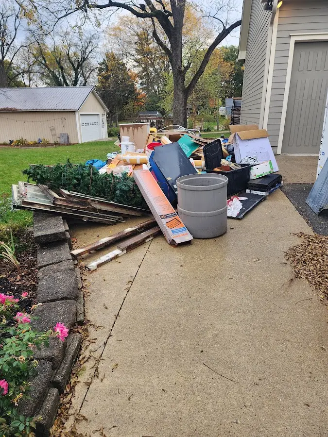 Dumpster being loaded with debris for 3 Yard Dumpster Rental in Tifton